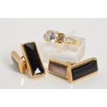 A 14CT GOLD CUBIC ZIRCONIA RING AND A PAIR OF 9CT GOLD ONYX CUFFLINKS, the ring designed as a