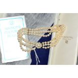 A THREE ROW CULTURED PEARL CHOKER NECKLACE with 9ct gold clasp, designed as three rows of uniform