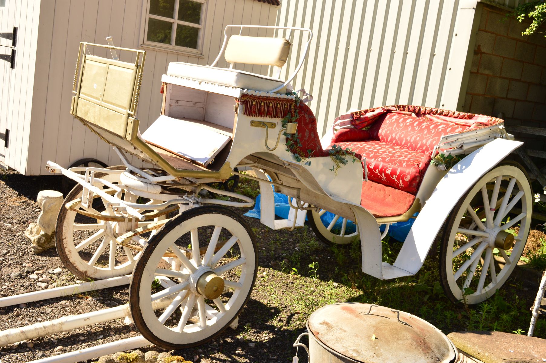 A HORSE DRAWN OPEN CARRIAGE with two double seats opposing double leaf suspension, folding canopy to