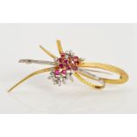 A RUBY AND DIAMOND SPRAY BROOCH, designed as a central cluster of circular claw set rubies with