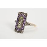 AN AMETHYST, DIAMOND AND PERIDOT DRESS RING, the rectangular panel set with a carved vertical line