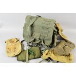 A LARGE DRAB OLIVE ARMY KIT BAG, containing eleven items of canvas webbing, kit pouches, etc some