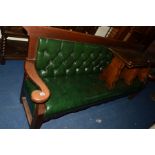AN EARLY 20TH CENTURY OAK HALL SETTLE, with scrolled arms and green leatherette upholstery, width
