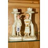 A PAIR OF ROYAL WORCESTER KATE GREENWAY STYLE FIGURAL CANDLESTICKS, modelled by James Hadley,