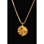 A 18CT GOLD RUBY AND DIAMOND ABSTRACT PENDANT, together with a 18ct gold box link chain, measuring
