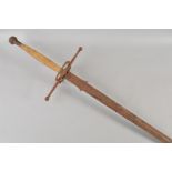 A LARGE MEDIEVAL STYLE FUNERY SWORD, large corded grip, large cross guard with circular protectors