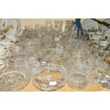 A COLLECTION OF CUT GLASSWARE, including vases, various bowls, cruet and condiment vessels, baskets,