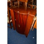 AN EDWARDIAN MAHOGANY CENTRAL BOWFRONT TWO DOOR CABINET