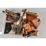 A LARGE GLASS TOP DEALER STYLE DISPLAY CASE CONTAINING THE FOLLOWING ITEMS, brown leather WWII era