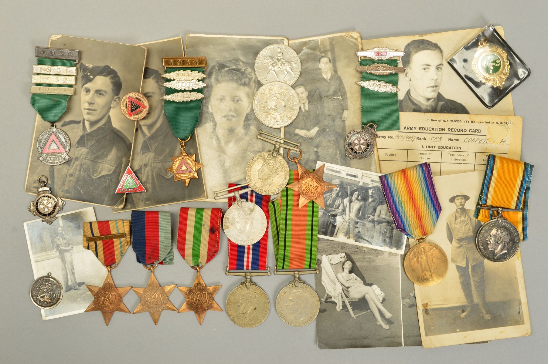 A BOX CONTAINING THE FOLLOWING BRITISH WAR AND VICTORY MEDAL PAIR, named to 61935 Pte G.H. Cooper,