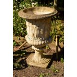 A LARGE COMPOSITE URN WITH GREEK DECORATION on a seperate base, diameter 63cm x height 92cm