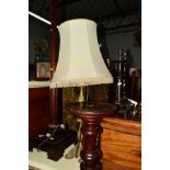 AN EDWARDIAN MAHOGANY COLUMN STANDARD LAMP on a square base, together with a brass table lamp with