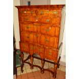 A REPRODUCTION WILLIAM AND MARY STYLE CHEST ON STAND, with an overhanging cornice, fitted with two