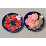 TWO MOORCROFT POTTERY PIN DISHES, 'Magnolia' on blue ground and 'Anemone' on blue ground,