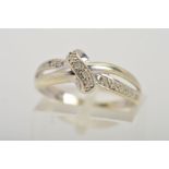 A 9CT WHITE GOLD DIAMOND DRESS RING, the top half designed as two rows with central loop detail