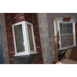 AN ANDERSEN DOUBLE HUNG WINDOW (one glazing unit missing) 124cm x 96cm, mounted including show