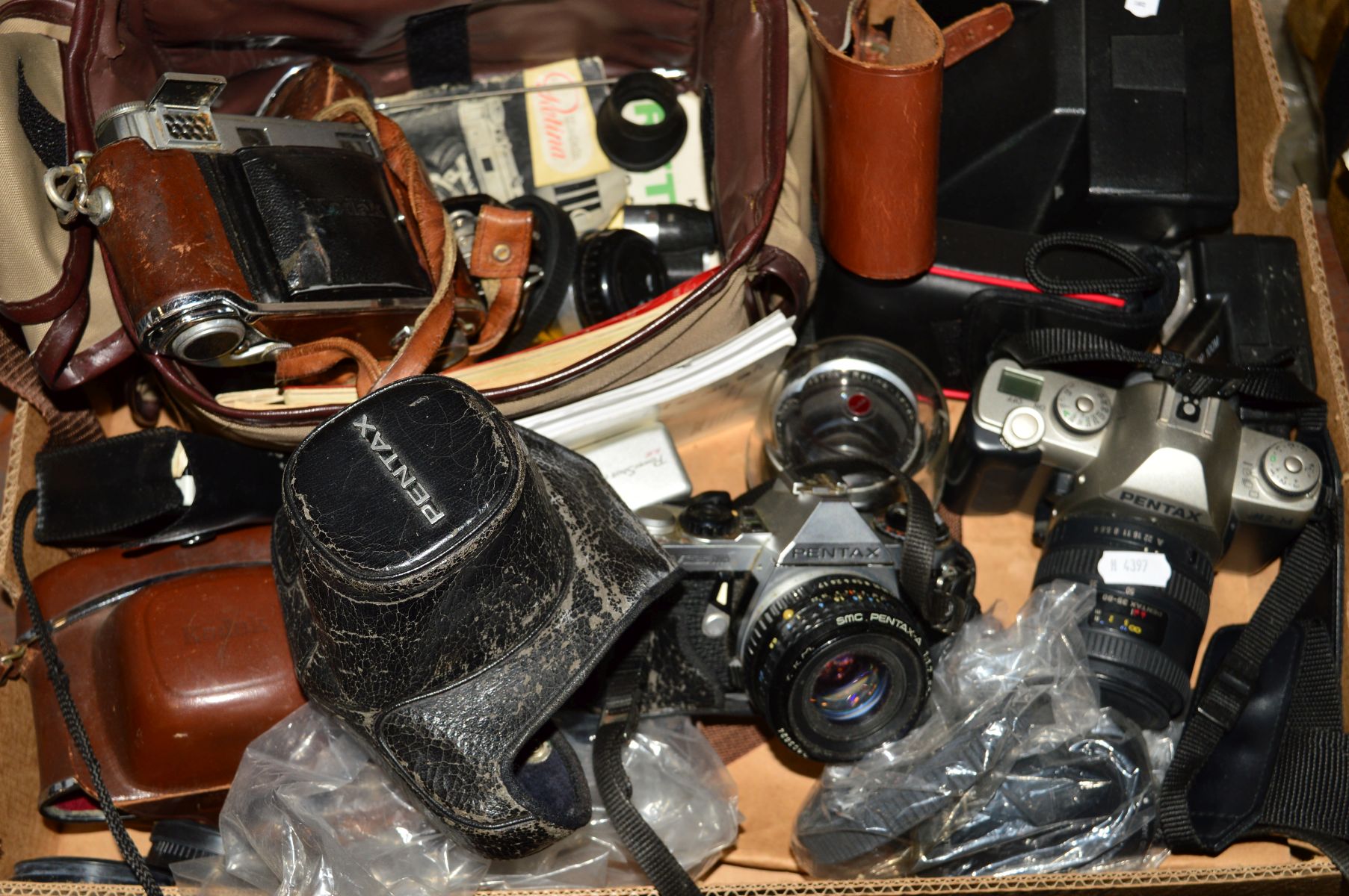 A TRAY OF CAMERAS AND EQUIPMENT, including a Pentax ME Super fitted with a 50mm f1.8 lens, a