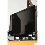 A LOGIC 32'' LED TV a modern standard lamp and a bevelled edge wall mirror (3)