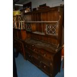 AN OAK DRESSER with three short drawers, width 137cm, an oak linenfold chest of three drawers and an