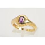 A 9CT GOLD AMETHYST RING, designed as an oval amethyst within a flush setting, with 9ct hallmark,