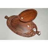 A NEST OF FOUR OVAL CARVED HARDWOOD TRAYS, the largest with scrolled handles, largest measures 50.