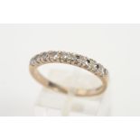 AN 18CT WHITE GOLD NINE STONE DIAMOND RING designed as a row of brilliant cut diamonds within four