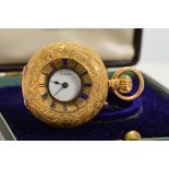 A CASED 18CT LADIES HALF HUNTER FOB WATCH BY J.W. BENSONS, foliate engraved with blind cartouche,