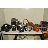 A COLLECTION OF VINTAGE CAMERAS including a Yashica C TLR, a Cosina PM-1 SLR, a boxed Braun Super