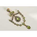 A PERIDOT, SEED PEARL AND DIAMOND PENDANT, designed with a central pear shape peridot within a