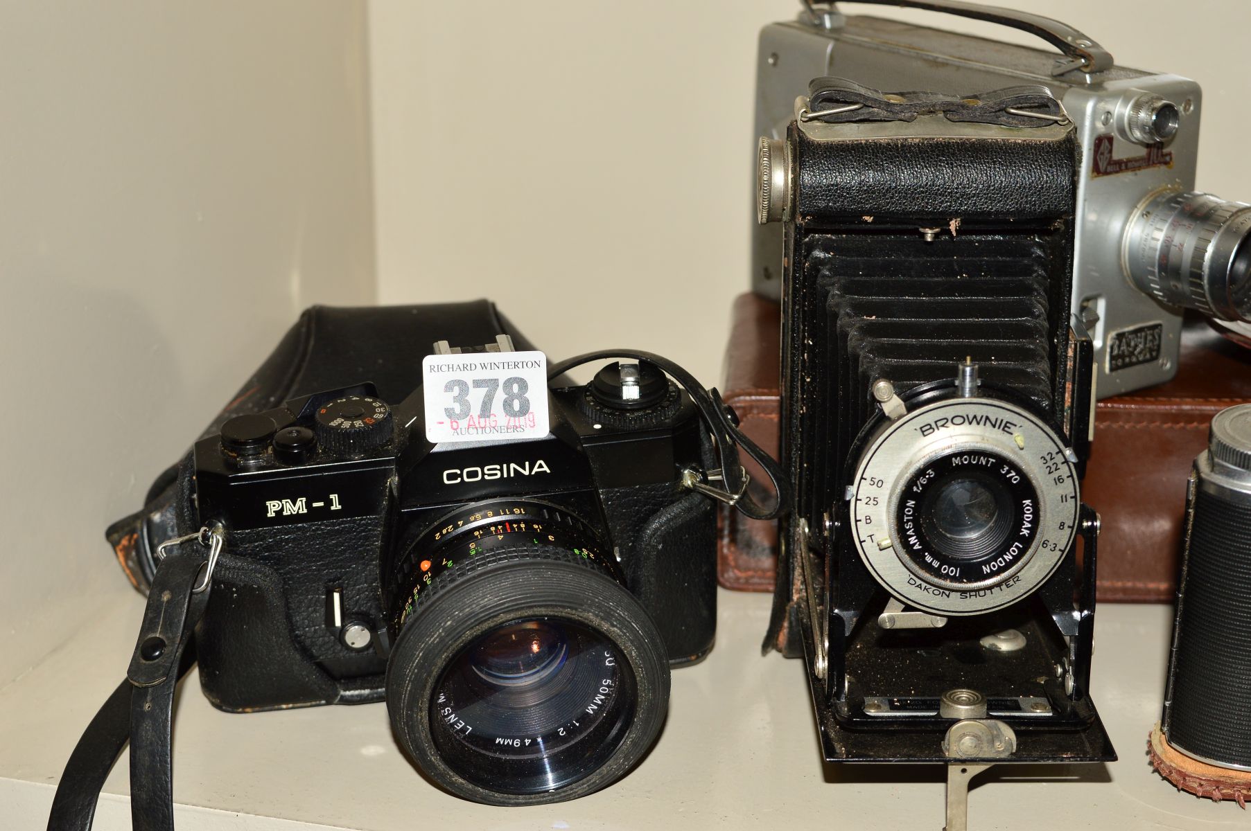 A COLLECTION OF VINTAGE CAMERAS including a Yashica C TLR, a Cosina PM-1 SLR, a boxed Braun Super - Image 2 of 4