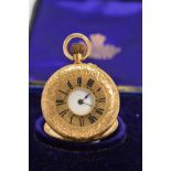 A CASED 18CT LADIES HALF HUNTER FOB WATCH, plated dust cover, Roman numeral, enamel dial, bent hands