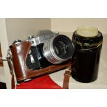 A ZENIT 3M VINTAGE FILM CAMERA, in leather case fitted with a Helios 55mm f2 lens and a 135mm f4