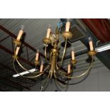 A LARGE BRASS NINE BRANCH CHANDELIER, together with an Art Deco style five branch ceiling light