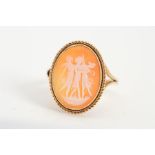 A 9CT GOLD CAMEO RING, designed as an oval cameo carved to depict the 'Three Graces' within a collet