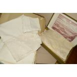 TWO BOXES OF EMBROIDERED TABLE LINEN, several cloths with matching napkins, one set with animal