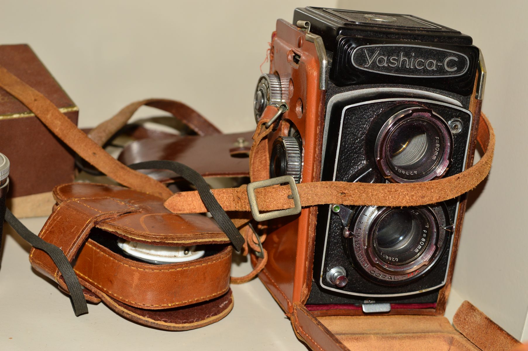 A COLLECTION OF VINTAGE CAMERAS including a Yashica C TLR, a Cosina PM-1 SLR, a boxed Braun Super - Image 4 of 4