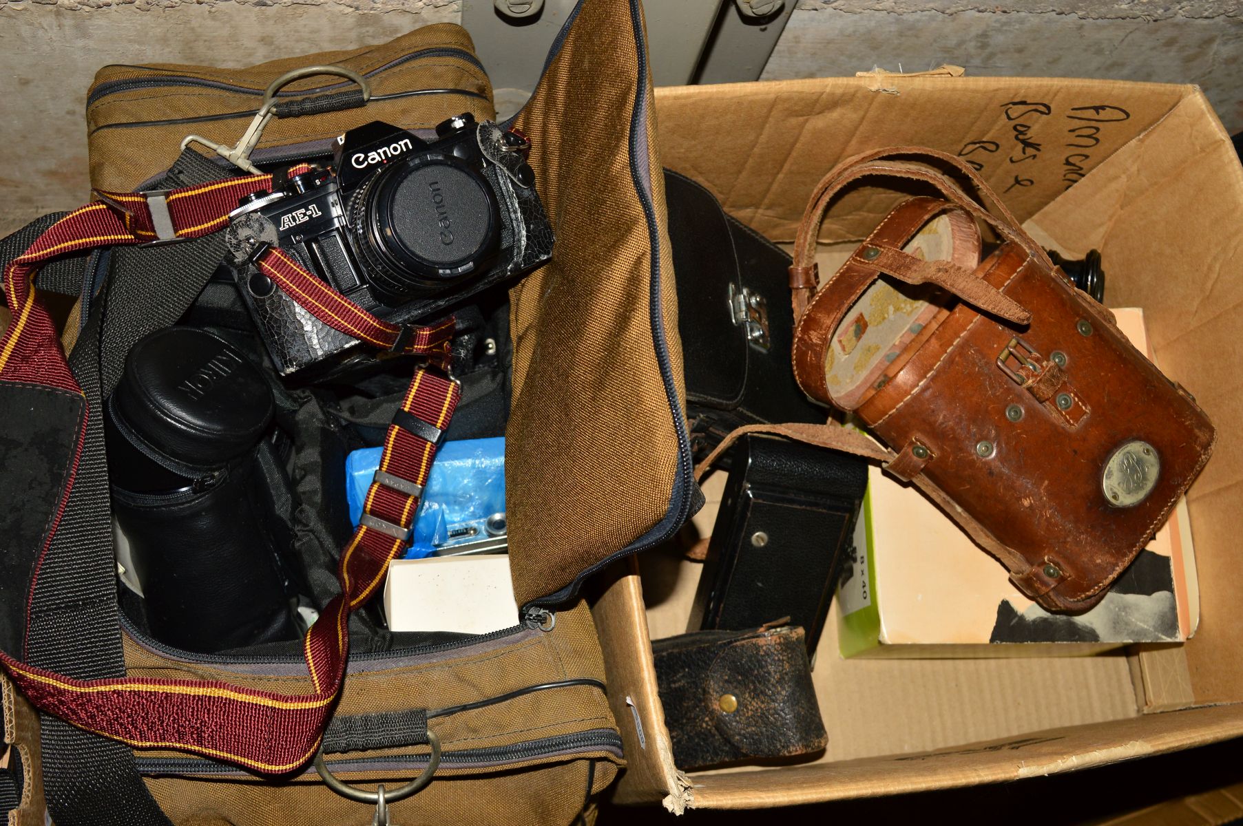 A CANON AE-1 SLR CAMERA, fitted with a 50mm f 1.8 in black, two Kiron lenses , a Kodak Vest