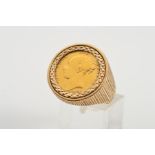 A HALF SOVEREIGN 9CT GOLD RING, set with an 1883 Victoria coin within a diamond cut surround to