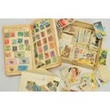 A SELECTION OF CIGARETTE CARDS AND A STAMP ALBUM, the cigarette cards to include a coronation