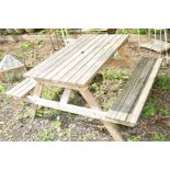 A TEAK GARDEN PICNIC BENCH, width 120cm x depth 150cm