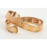 A 9CT GOLD TRI-COLOUR BRACELET, designed as rectangular panels in rose, yellow and white gold with