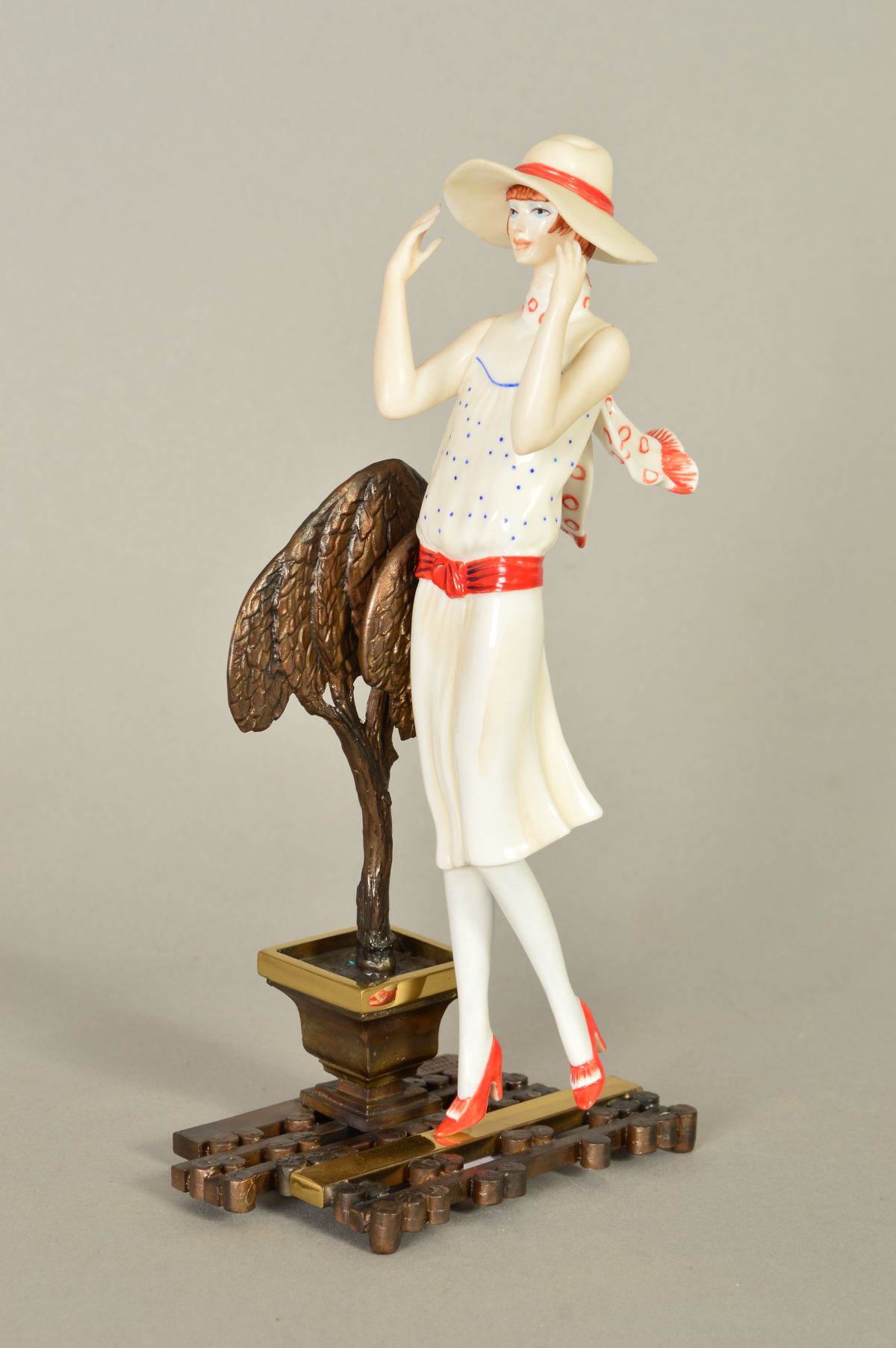 AN ALBANY BONE CHNA AND BRONZE FIGURINE, 'Chelsea' from the twenty's series, height 20cm
