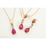 A GLASS FILLED RUBY PENDANT AND MATCHING DROP EARRINGS, the pendant designed as a pear shape glass