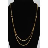 A 9CT GOLD NECKLACE, designed as a squared S-link chain with double chain to the lower half