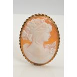 A 9CT GOLD CAMEO BROOCH, of oval outline carved to depict a lady in profile to the double rope twist