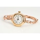 A 1920's 9CT GOLD LADY'S WRIST WATCH, the circular face with white dial, Arabic numerals and