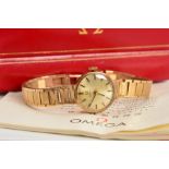 A CASED 9CT GOLD LADY'S OMEGA WRIST WATCH, the circular head with baton hour markers and tapered