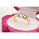 AN 18CT GOLD SINGLE STONE DIAMOND RING, designed as a brilliant cut diamond within a white metal