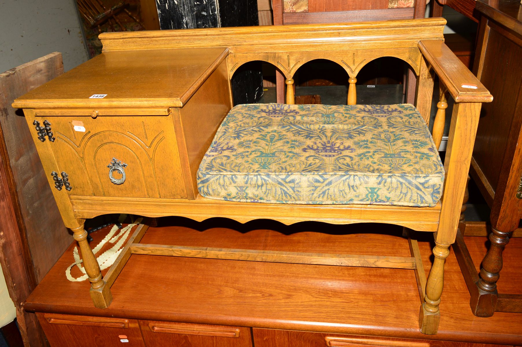 A LIGHT OAK TELEPHONE TABLE/SEAT together with a pine standard lamp and a ceramic table lamp (3)