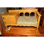 A LIGHT OAK TELEPHONE TABLE/SEAT together with a pine standard lamp and a ceramic table lamp (3)